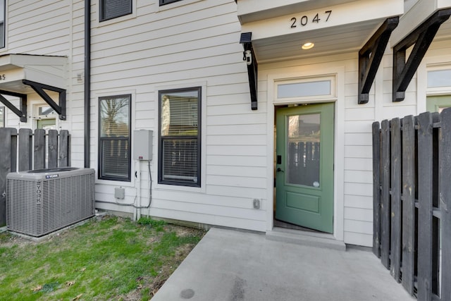 doorway to property featuring central AC