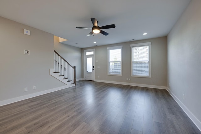 interior space featuring ceiling fan and dark wood-type flooring