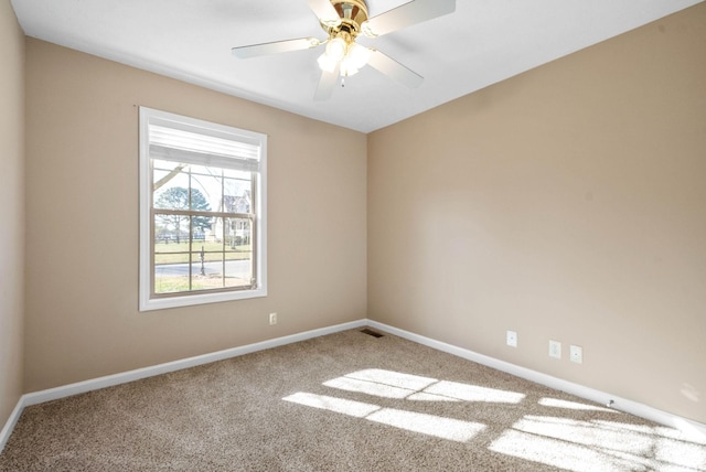 carpeted empty room with ceiling fan