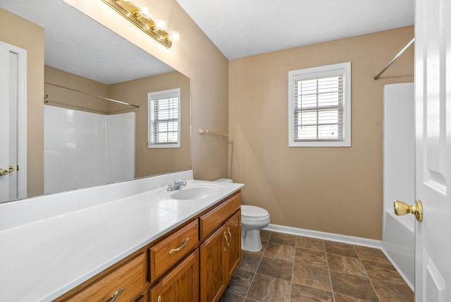 bathroom featuring vanity and toilet