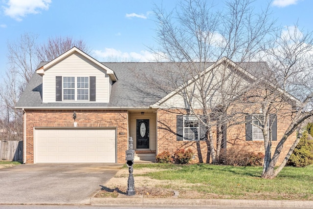 view of front of house featuring a garage and a front lawn