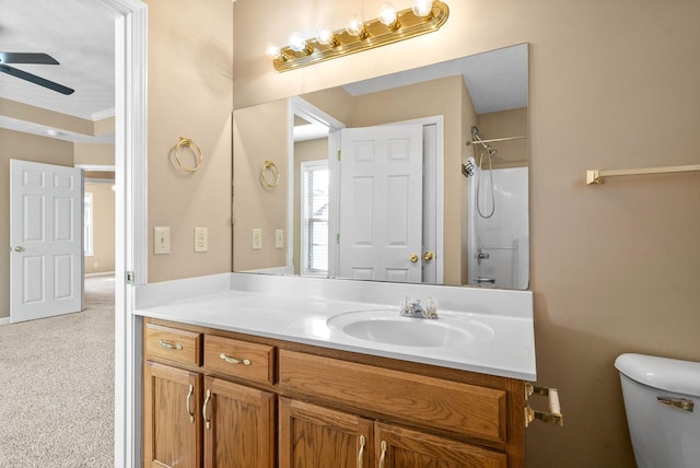 bathroom with ceiling fan, vanity, and toilet