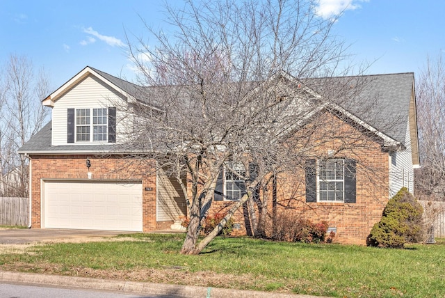 front of property featuring a garage and a front lawn