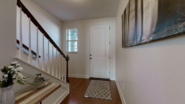 foyer with dark hardwood / wood-style floors