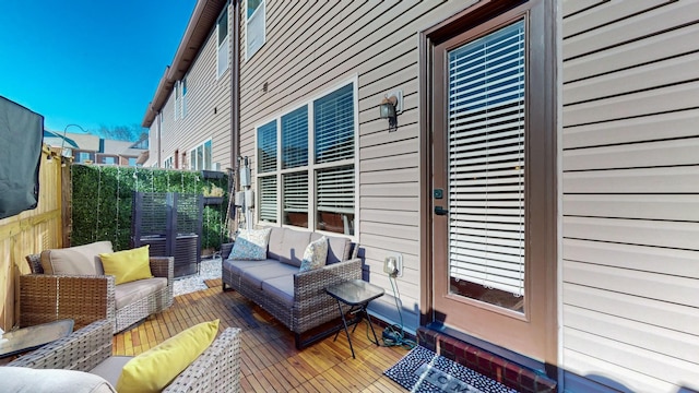 wooden terrace featuring outdoor lounge area