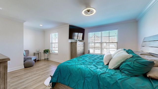 bedroom featuring light hardwood / wood-style flooring and ornamental molding