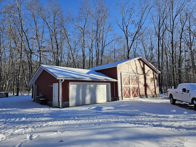 view of snow covered garage