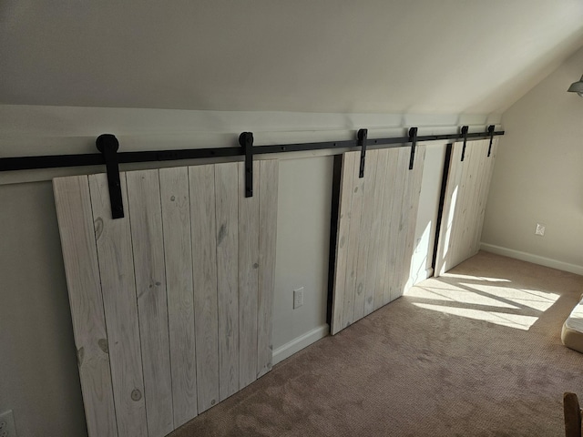 interior space with lofted ceiling and light carpet