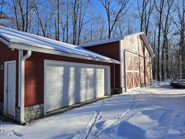 view of snow covered garage