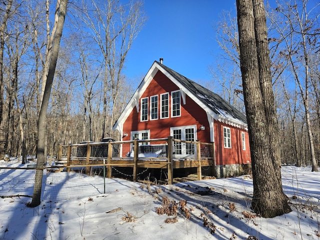 view of property featuring a wooden deck