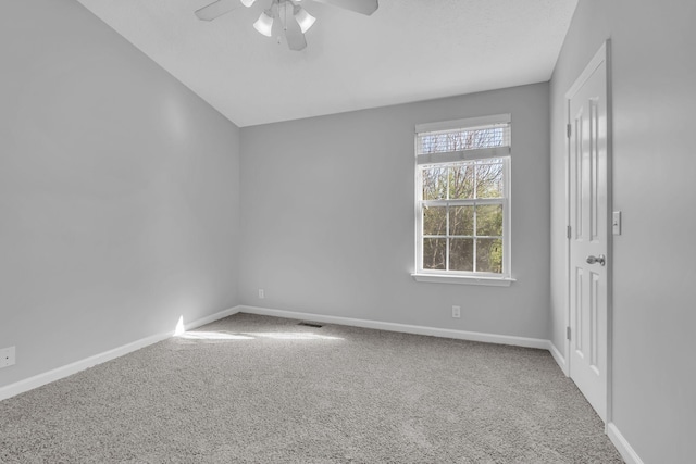 spare room featuring carpet flooring and ceiling fan