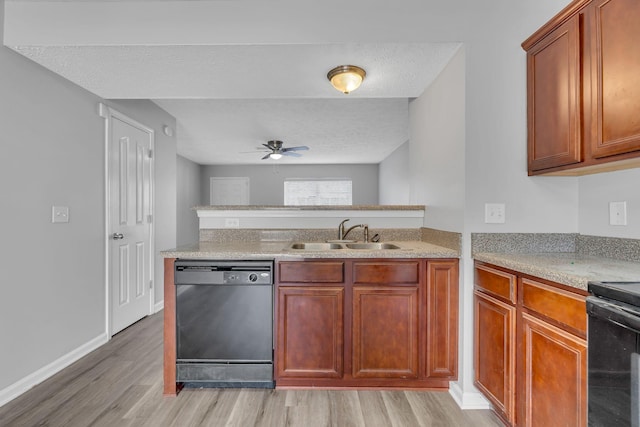 kitchen with black appliances, sink, ceiling fan, a textured ceiling, and light hardwood / wood-style floors