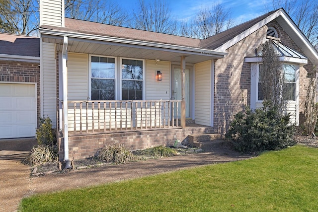 ranch-style house with a garage, a front lawn, and a porch