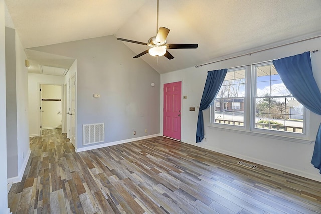 interior space featuring hardwood / wood-style floors, high vaulted ceiling, and ceiling fan