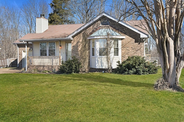 view of front of home with a porch and a front lawn