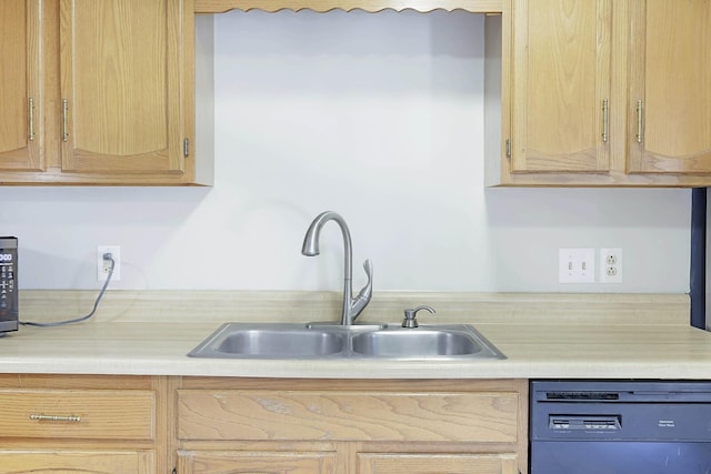 kitchen with light brown cabinetry, sink, and dishwasher