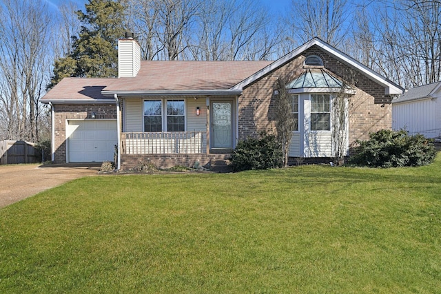 view of front of property featuring a garage and a front lawn