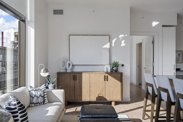 living room with dark hardwood / wood-style flooring