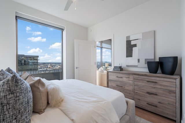 bedroom with hardwood / wood-style flooring and ceiling fan