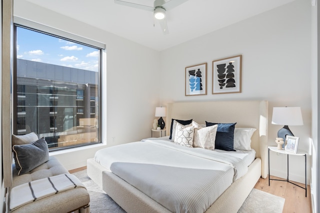 bedroom featuring hardwood / wood-style flooring and ceiling fan