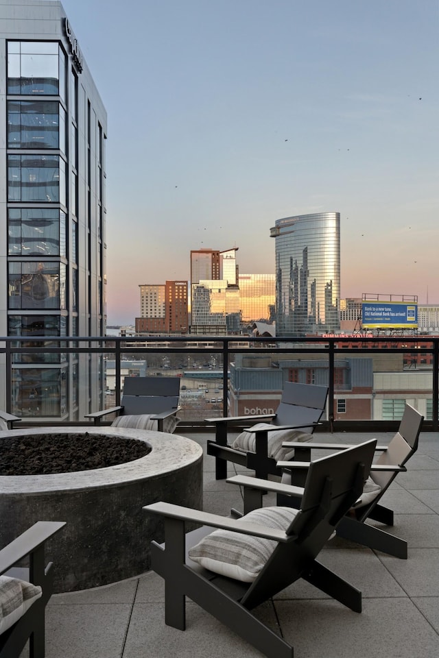 patio terrace at dusk with a balcony