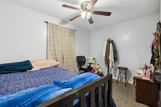 bedroom with ceiling fan and carpet floors