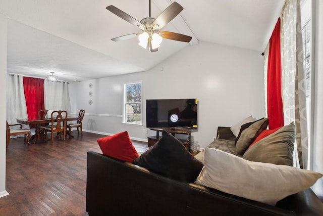 living room with ceiling fan, dark hardwood / wood-style flooring, and vaulted ceiling