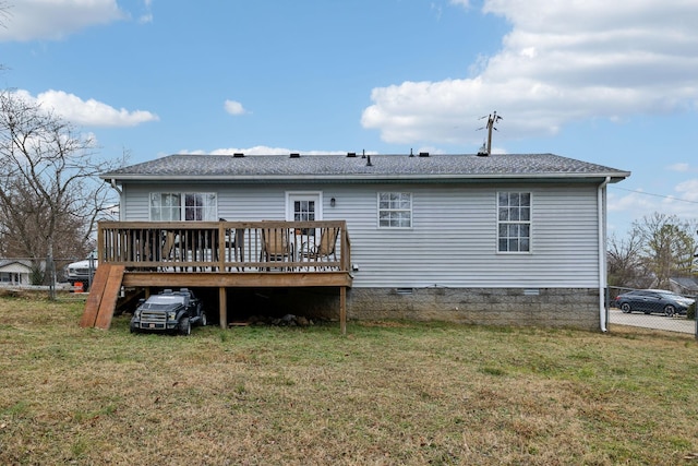 back of house featuring a yard and a deck