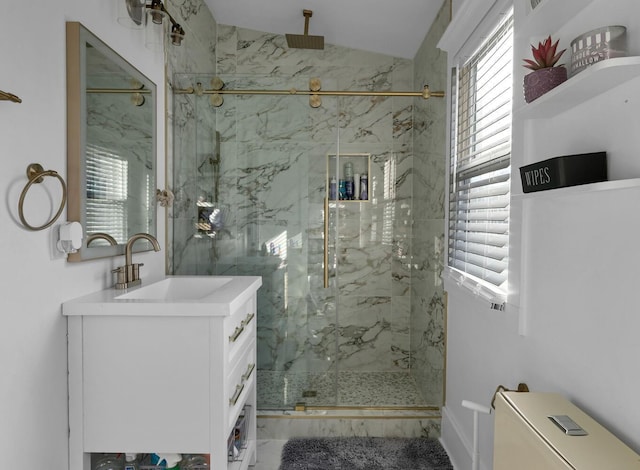 bathroom featuring toilet, vanity, vaulted ceiling, and a shower with shower door