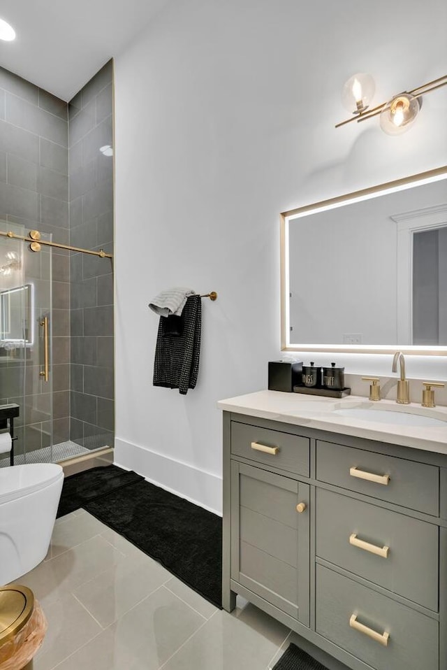 bathroom with tile patterned flooring, vanity, toilet, and a shower with door