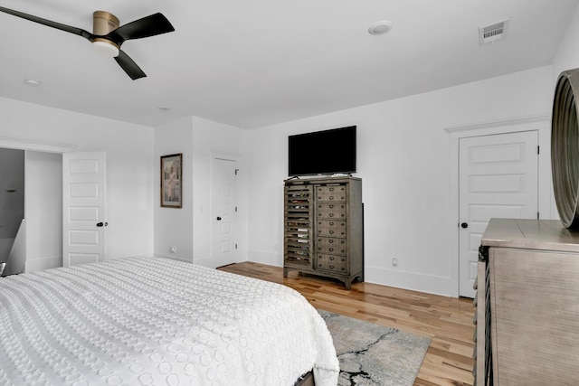 bedroom with light wood-type flooring and ceiling fan