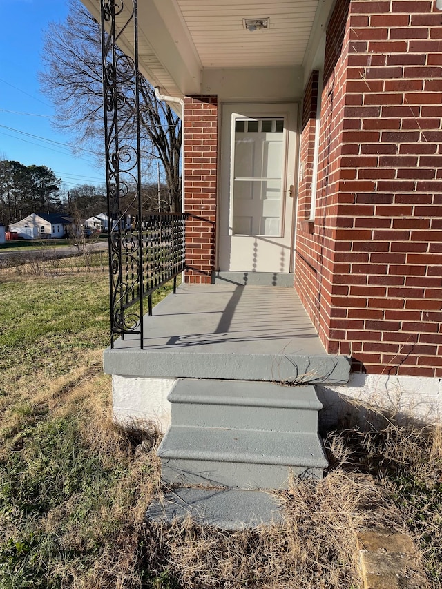 view of exterior entry featuring a porch