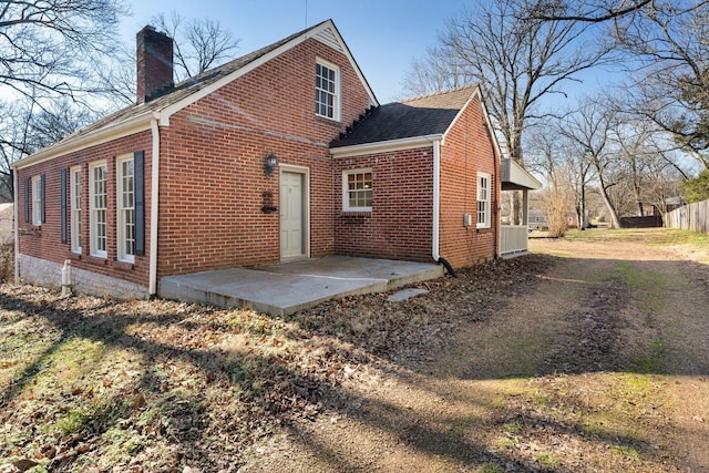 back of property featuring a patio area