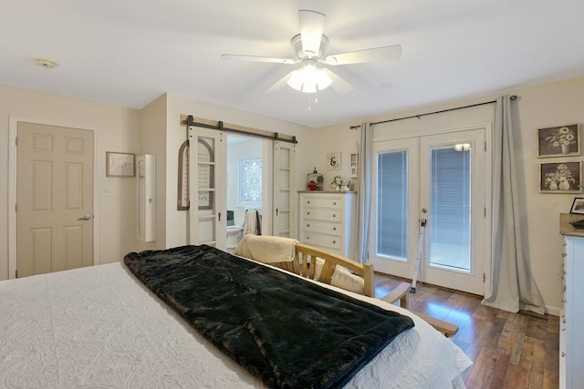 bedroom with ceiling fan, access to exterior, a barn door, and french doors