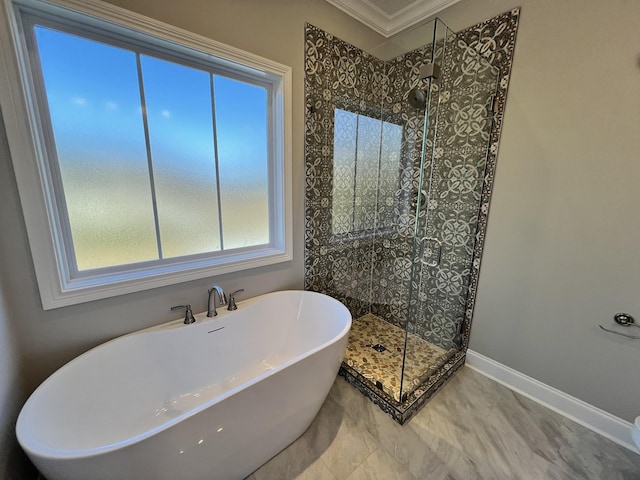 bathroom with separate shower and tub and ornamental molding