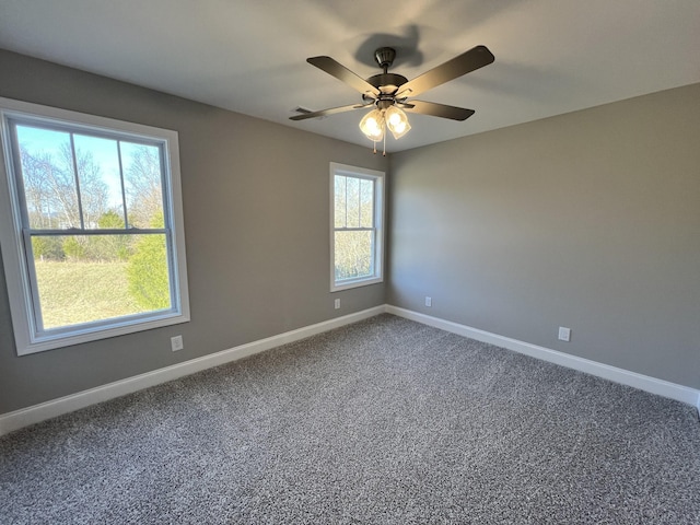 unfurnished room with carpet flooring and ceiling fan