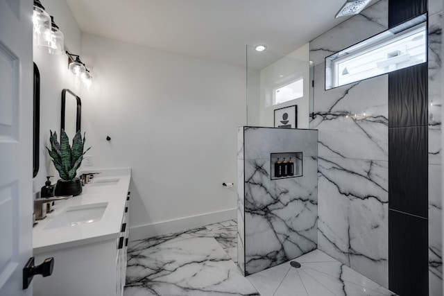 bathroom with vanity and a shower