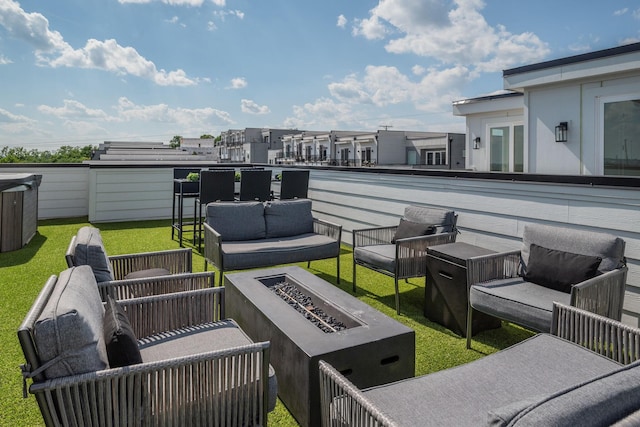 view of patio featuring an outdoor living space with a fire pit