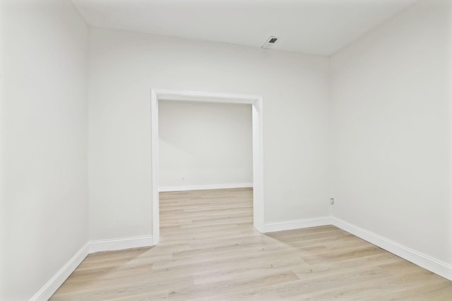 spare room featuring light hardwood / wood-style floors