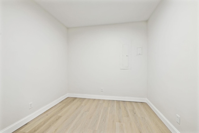 unfurnished room with light hardwood / wood-style flooring