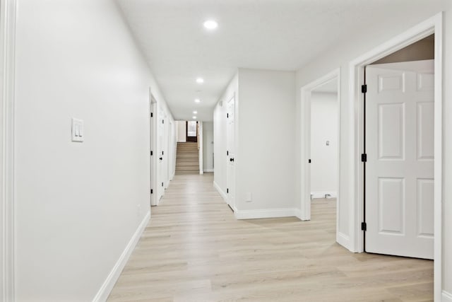 corridor with light wood-type flooring