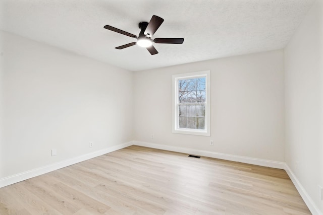 unfurnished room with ceiling fan and light hardwood / wood-style floors