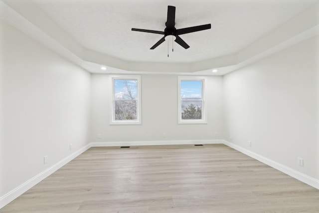 spare room with ceiling fan and light hardwood / wood-style flooring