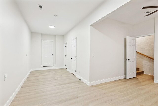 hall with light hardwood / wood-style flooring