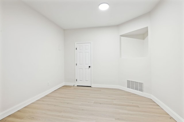 spare room with light wood-type flooring