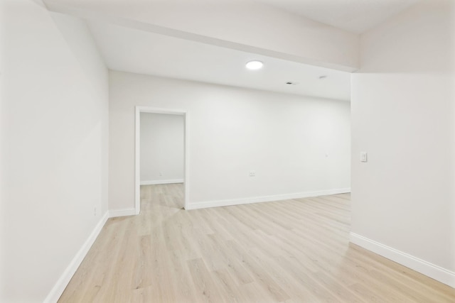 unfurnished room with light wood-type flooring