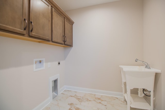 washroom featuring hookup for a washing machine, cabinets, and hookup for an electric dryer