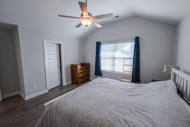 bedroom with ceiling fan, dark hardwood / wood-style floors, and vaulted ceiling