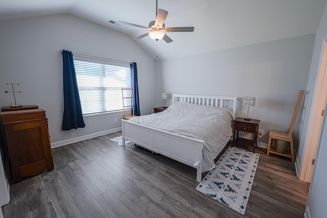 bedroom with lofted ceiling, dark hardwood / wood-style floors, and ceiling fan