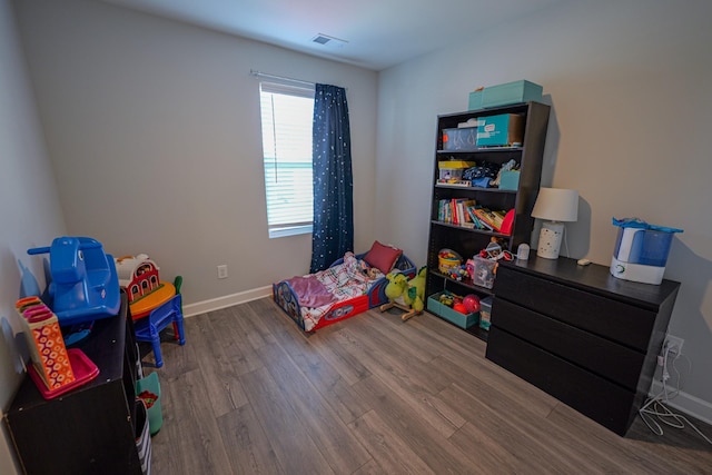 bedroom featuring wood-type flooring